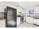 Bright kitchen features white cabinets, granite countertops, stainless steel appliances, and tile backsplash at 2654 Jefferson Ter, Atlanta, GA 30344