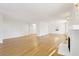 Bright living room featuring hardwood floors, a fireplace, and white trim at 2654 Jefferson Ter, Atlanta, GA 30344