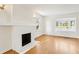 Bright living room featuring hardwood floors, a fireplace, and a bay window at 2654 Jefferson Ter, Atlanta, GA 30344