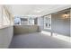 Cozy sunroom with neutral carpet, multiple windows providing ample natural light, and a gray paneled exterior at 2654 Jefferson Ter, Atlanta, GA 30344