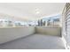 Enclosed sunroom featuring large windows with backyard views and a neutral color palette at 2654 Jefferson Ter, Atlanta, GA 30344