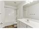 Bathroom featuring a shower and tub, vanity, white cabinets and dark wood floor at 3277 Wyesham Cir, Duluth, GA 30096