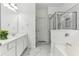Bathroom featuring a glass shower and soaking tub at 3277 Wyesham Cir, Duluth, GA 30096
