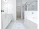 Bathroom with marble floors, double sink, separate shower, and bathtub at 3277 Wyesham Cir, Duluth, GA 30096