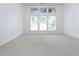 Bright bedroom with neutral carpet and large windows providing natural light at 3277 Wyesham Cir, Duluth, GA 30096