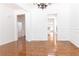 Bright dining room featuring beautiful hardwood floors, classic wainscoting, and an elegant chandelier at 3277 Wyesham Cir, Duluth, GA 30096