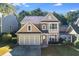 Two-story home boasting an attached garage, and neutral color palette with an inviting front entrance at 3277 Wyesham Cir, Duluth, GA 30096
