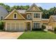 Inviting home with a two-car garage, attractive siding, and well-kept lawn at 3277 Wyesham Cir, Duluth, GA 30096