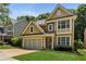 Charming home with a two-car garage and manicured lawn at 3277 Wyesham Cir, Duluth, GA 30096