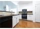 Kitchen with stainless steel appliances, tile backsplash, and white cabinets at 3277 Wyesham Cir, Duluth, GA 30096