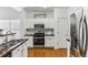 Modern kitchen with stainless steel appliances and white cabinets at 3277 Wyesham Cir, Duluth, GA 30096