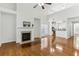 Open concept living room featuring a fireplace and hardwood floors at 3277 Wyesham Cir, Duluth, GA 30096
