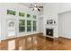Spacious living room with hardwood floors, fireplace, and ample natural light at 3277 Wyesham Cir, Duluth, GA 30096