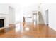 Bright living space featuring hardwood floors, fireplace, and an open floor plan connected to the kitchen and stairs at 3277 Wyesham Cir, Duluth, GA 30096