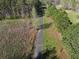 Aerial shot of tree-lined driveway leading to home at 512 E Valley Ne Rd, Rydal, GA 30171