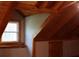 Attic nook offering natural light, storage space, and wood beam features at 512 E Valley Ne Rd, Rydal, GA 30171