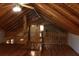 Charming attic space featuring wood beams, flooring, and a ceiling fan at 512 E Valley Ne Rd, Rydal, GA 30171