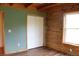 This bedroom features white closet doors, a large window and gorgeous hardwood trim at 512 E Valley Ne Rd, Rydal, GA 30171