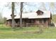 Charming log home with a metal roof, inviting front porch, and a well-maintained yard at 512 E Valley Ne Rd, Rydal, GA 30171