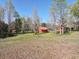Exterior sheds and wooded surroundings on the expansive lot at 512 E Valley Ne Rd, Rydal, GA 30171