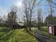 Charming home exterior with a shed, set amongst mature trees and a spacious yard at 512 E Valley Ne Rd, Rydal, GA 30171