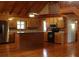Open kitchen with wood cabinets, stainless steel appliances, and center island at 512 E Valley Ne Rd, Rydal, GA 30171
