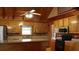 Bright kitchen with wood cabinets, stainless steel appliances, and center island at 512 E Valley Ne Rd, Rydal, GA 30171