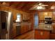 Well-lit kitchen with wood cabinetry, a stainless-steel fridge, and an island at 512 E Valley Ne Rd, Rydal, GA 30171