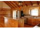 Open kitchen featuring wood cabinets, stainless steel appliances, and island at 512 E Valley Ne Rd, Rydal, GA 30171