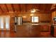 Kitchen with wood cabinets, stainless steel appliances, and island at 512 E Valley Ne Rd, Rydal, GA 30171