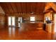 Spacious kitchen and living area with wood floors, vaulted ceiling, and stainless steel appliances at 512 E Valley Ne Rd, Rydal, GA 30171