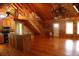 Bright and airy living space with a wooden staircase, and an open-concept kitchen at 512 E Valley Ne Rd, Rydal, GA 30171