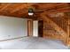 Inviting living room with wood paneling and staircase, offering a cozy and rustic ambiance at 512 E Valley Ne Rd, Rydal, GA 30171