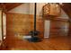Spacious living room with wood walls and floors, fireplace, and loft area at 512 E Valley Ne Rd, Rydal, GA 30171