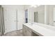 Stylish bathroom with dual vanities, tile flooring, and tub-shower combination at 939 Brittfield Way, Loganville, GA 30052