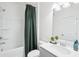 Clean bathroom with shower and tub, modern sink, and ample lighting at 939 Brittfield Way, Loganville, GA 30052