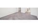 Bright bedroom with neutral carpet, a view into the hallway, and white trim at 939 Brittfield Way, Loganville, GA 30052
