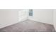 Bedroom with neutral carpet, white walls, and plenty of natural light from a window at 939 Brittfield Way, Loganville, GA 30052