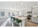 Modern kitchen with granite countertops, stainless steel appliances, and stylish pendant lighting at 939 Brittfield Way, Loganville, GA 30052