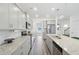 Elegant kitchen featuring granite countertops, stainless steel appliances, and ample cabinet space at 939 Brittfield Way, Loganville, GA 30052