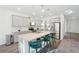 Modern kitchen with granite countertops, stainless steel appliances, and an island with seating at 939 Brittfield Way, Loganville, GA 30052
