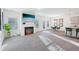 Open floor plan with a fireplace, breakfast bar, and eat-in kitchen at 939 Brittfield Way, Loganville, GA 30052