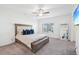 Cozy main bedroom features a plush bed with a tufted headboard and a ceiling fan at 939 Brittfield Way, Loganville, GA 30052