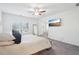 Bright and airy main bedroom with plush bed, ample natural light, and neutral tones at 939 Brittfield Way, Loganville, GA 30052
