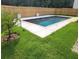 In-ground pool with cool deck, surrounded by new wooden fence and green grass at 939 Brittfield Way, Loganville, GA 30052
