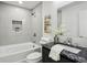 Updated bathroom features granite counters and a sleek white tub at 863 Birch St, Forest Park, GA 30297