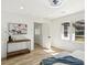 Bright bedroom features modern ceiling fan, wood-look floors, and natural light from large window at 863 Birch St, Forest Park, GA 30297
