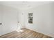 Well-lit bedroom featuring wood-look floors and a closet at 863 Birch St, Forest Park, GA 30297