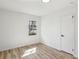 Light-filled bedroom featuring wood-look floors and closet at 863 Birch St, Forest Park, GA 30297