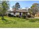 Charming single-story home with a well-maintained lawn and mature landscaping, perfect for suburban living at 863 Birch St, Forest Park, GA 30297